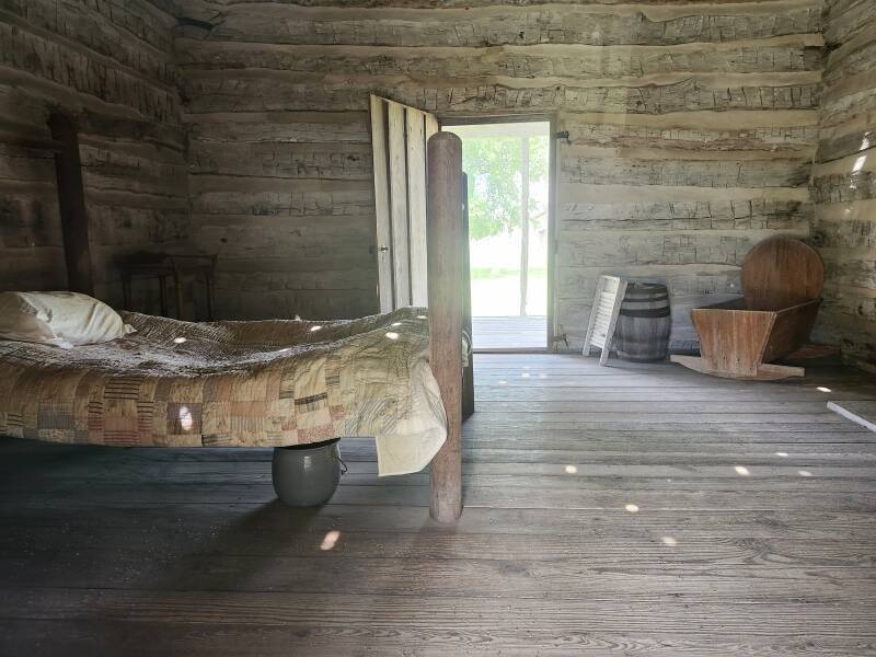Original Johnson cabin in the Johnson Settlement, with visible chamber pot.