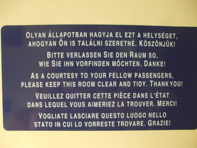 Multi-language sign in the washroom on board EuroCity passenger train from Budapest to Prague.