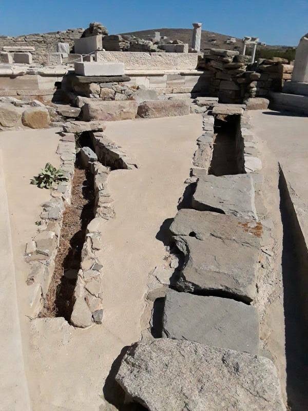 Drain associated with public latrine along the west side of the Agora of the Italians, just south of the Letoön, at Delos.