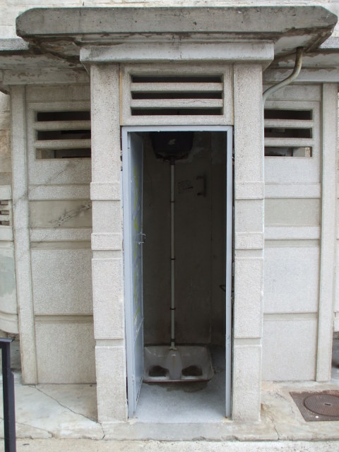 Concrete public squat toilet in Arles, in the south of France.