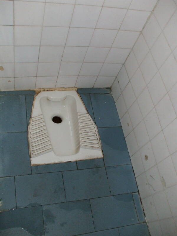 Squat toilet at the train station in Kalambaka, Greece.