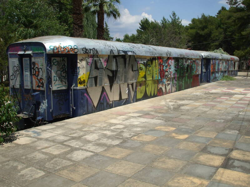 Graffiti-covered train in a park in Nafplio, Greece.