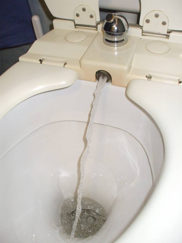 Toilet with a built-in bidet in a hotel in Perugia.