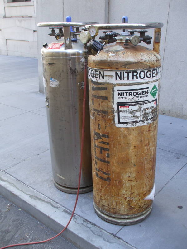Two dewar vacuum flasks of liquid nitrogen along the street in front of the New York Stock Exchange, in Manhattan's Financial District.