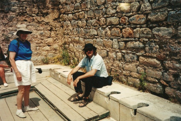 The Toilet Guru sitting on an ancient Greek toilets in Ephesus, in west Turkey.