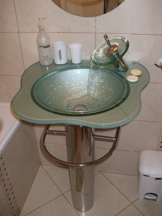 Very nice glass sink with 'bowl' style faucet.