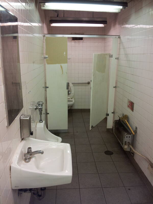 Toilet, urinal and sink in the Delancy Street — Essex Street station of the New York City MTA subway system in Manhattan.