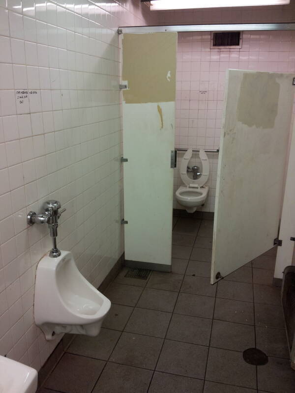 Toilet and urinal in the Delancey Street — Essex Street station of the New York City MTA subway system in Manhattan.