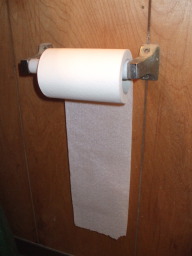 Incorrect orientation of toilet paper roll.