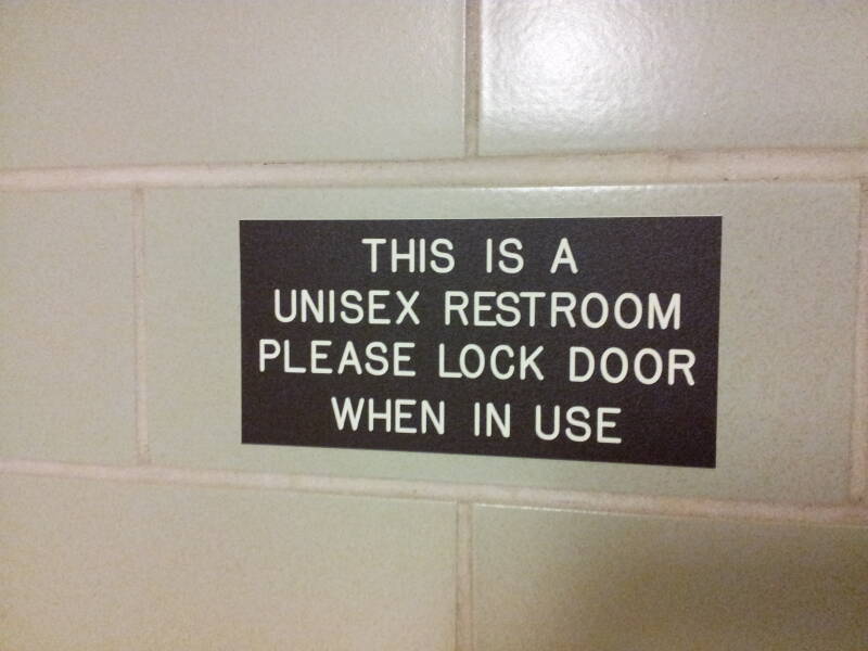 Signs at entry to unisex restroom at Purdue University.